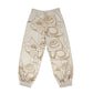 FEWOCiOUS Cream Sweatpants featuring artistic screen-printed design on tan French Terry cotton